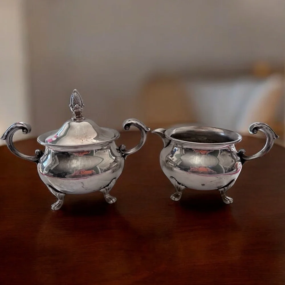 vintage EPCA Bristol by Poole ornate silver-plated sugar bowl and a creamer.